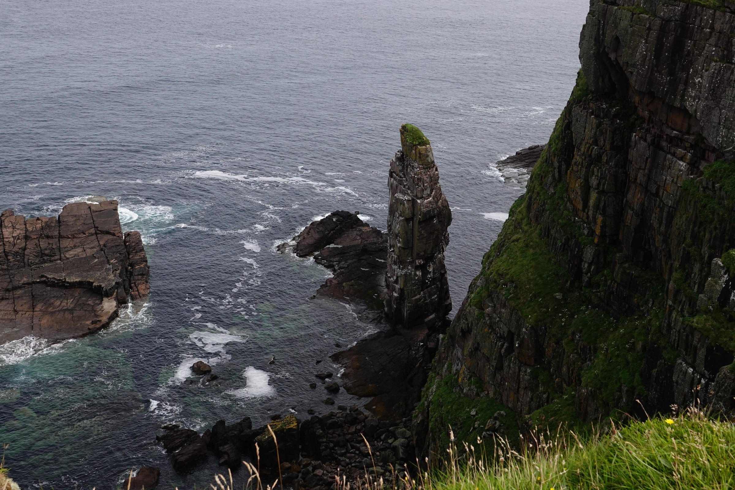 Tall sea stack below the cliffs of Handa Island
